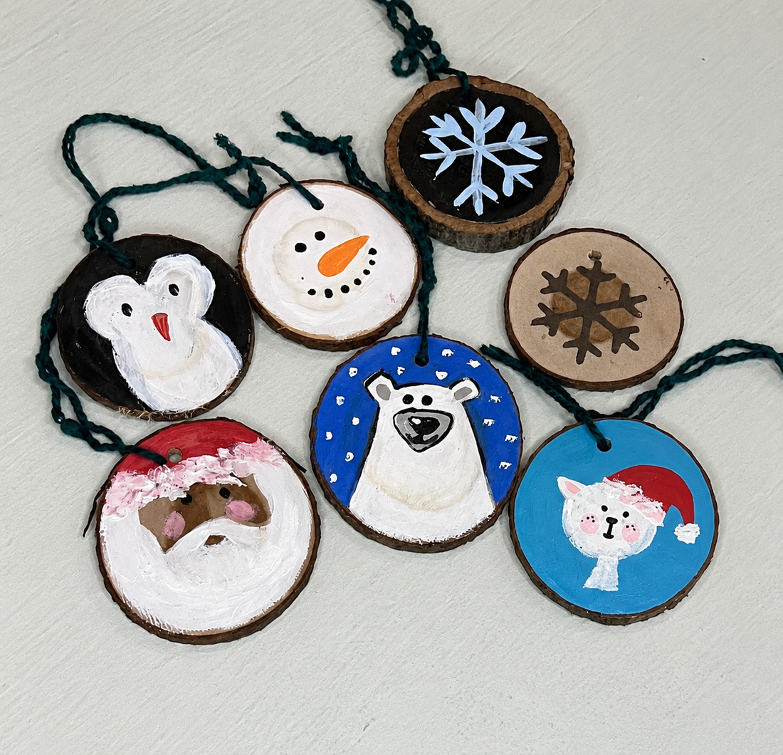 Hand-painted wood slice Christmas ornaments by Caron Designs: Santa, penguin, snowman, polar bear, snowflakes and a kitten in a Santa hat
