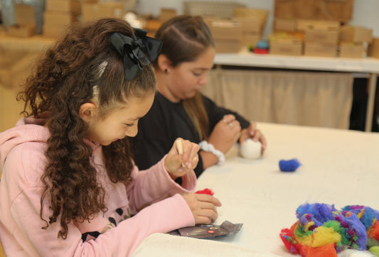 Children 8 and up enjoying the art of needle felting