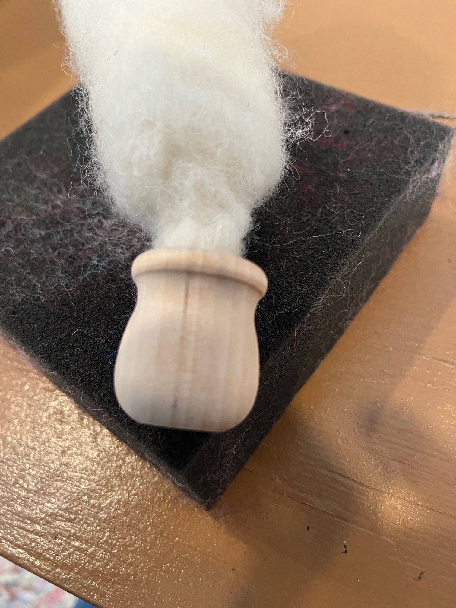 Ivory wool felted into a bean pot for the base of a mushroom by Caron Designs
